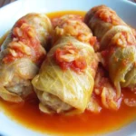 Hungarian stuffed cabbage rolls simmered in savory tomato sauce for a hearty traditional meal.