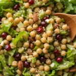 lettuce cranberry nuts chickpea salad in a bowl