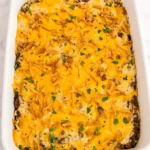 Easy hobo casserole recipe baked with ground beef, creamy sauce, cheddar cheese, and crispy onion topping