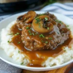 Salisbury steak in Instant Pot with mushroom gravy over mashed potatoes