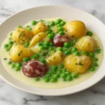 Cream peas and potatoes with baby red potatoes in creamy white sauce