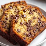 Slices of moist banana bread loaded with chocolate chips.
