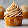 Moist pumpkin cupcakes topped with cinnamon-spiced cream cheese frosting