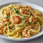 Shrimp scampi pasta with garlic butter, parsley, parmesan, and red chili flakes