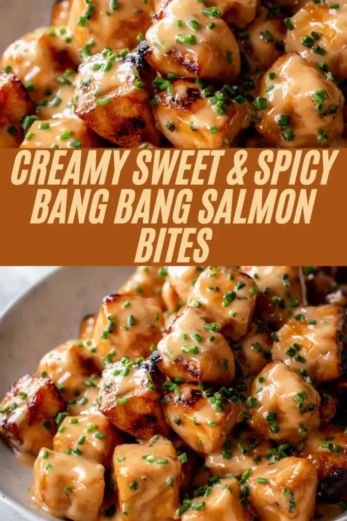 Creamy sweet and spicy bang bang salmon bites piled high with glossy sauce and green onions in a bowl.