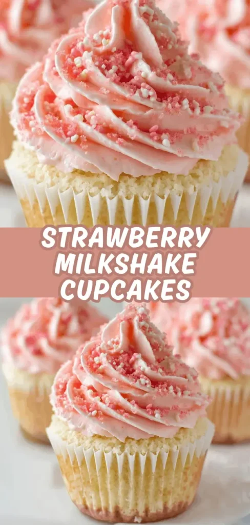 Close-up of a strawberry milkshake cupcake with pink frosting, sprinkles, and a crumbly topping, with additional cupcakes blurred in the background.