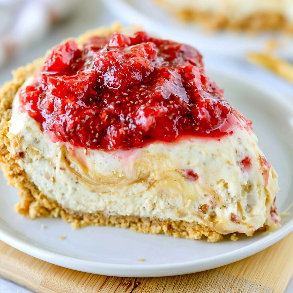Delectable peanut butter and jelly icebox pie assembled with a graham cracker crust and a creamy peanut butter filling topped with a thin layer of vibrant jelly.
